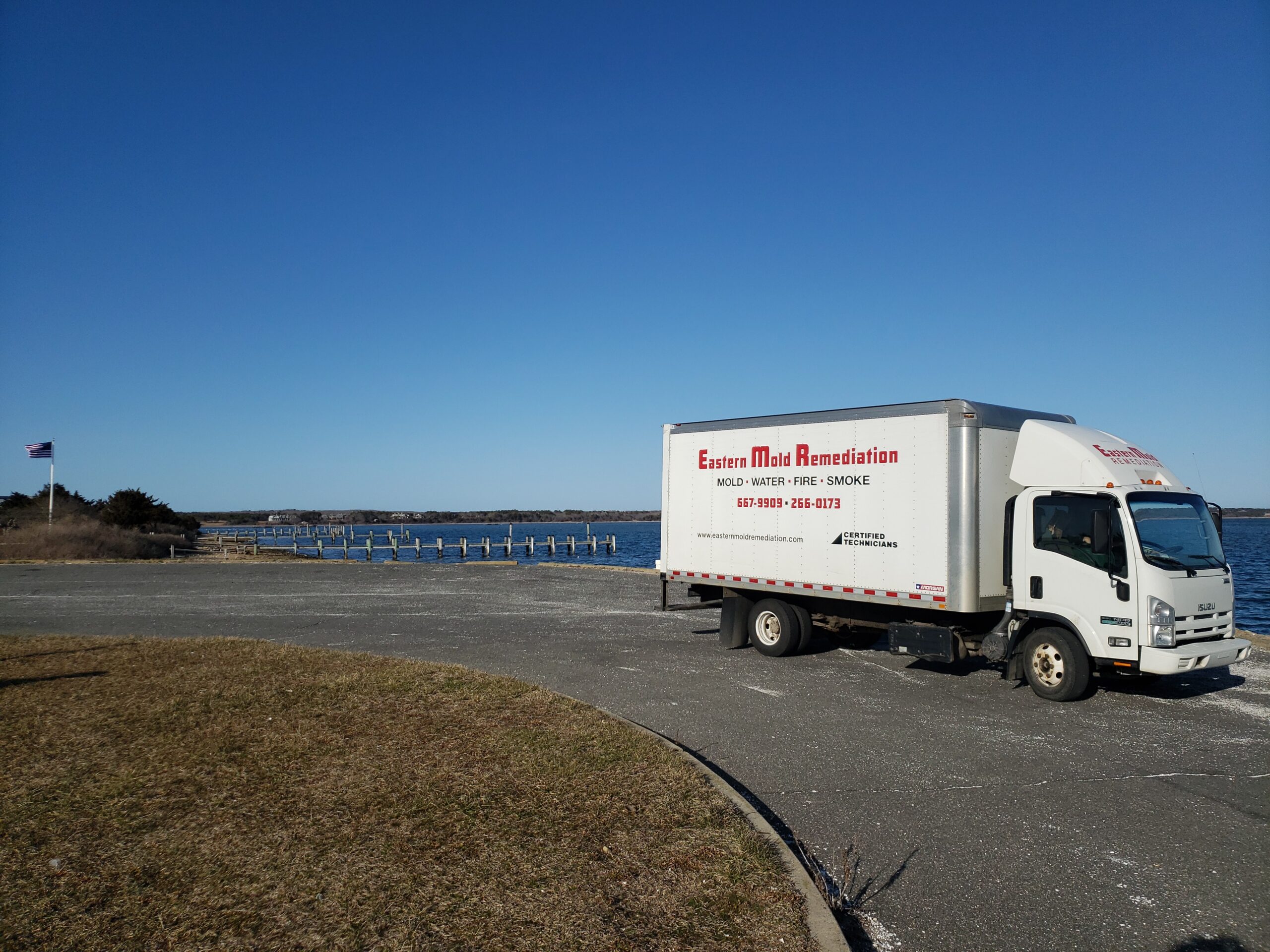 Photo of the outside of the Eastern Basements building with an Eastern Basements box truck